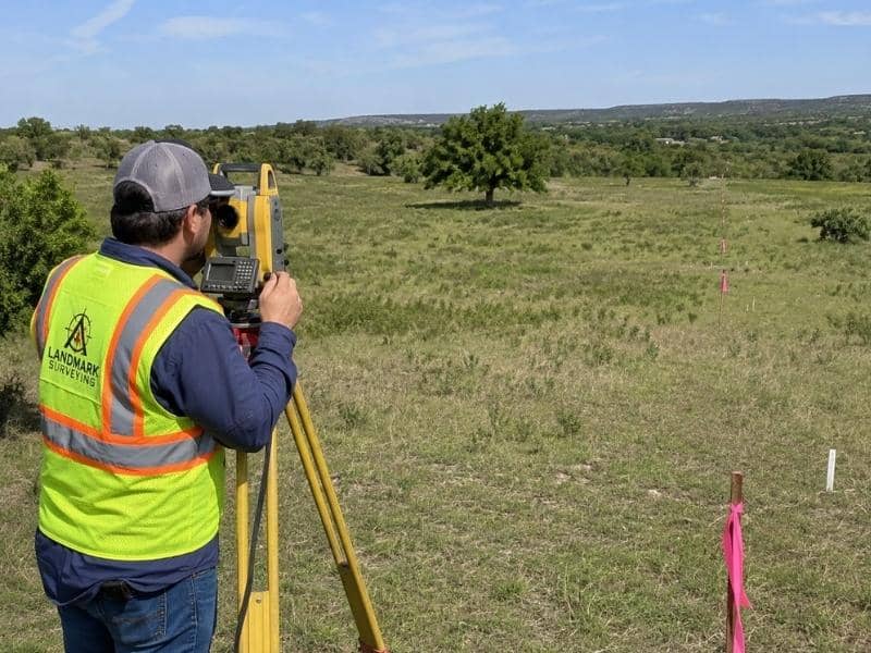 Boundary Survey crew marking new home site divisions on large acreage in New Braunfels Texas